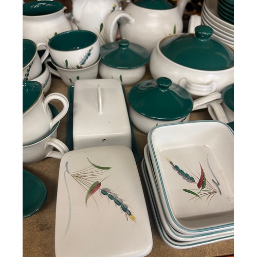 392 - Large selection of Denby Ware green wheat pottery to include part dinner and tea services approximat... 