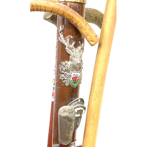 234 - Selection vintage and later walking sticks to include a silver top piece together in stand stick