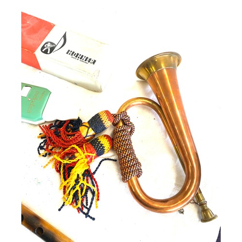 140 - Selection of vintage and later musical instruments to include military copper bugle, Hohner melodica... 