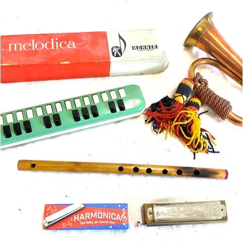 140 - Selection of vintage and later musical instruments to include military copper bugle, Hohner melodica... 