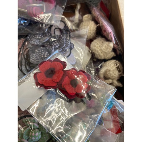 282 - Large selection of assorted new felt hair clips, knitted brooch / badges etc (3 boxes in total)