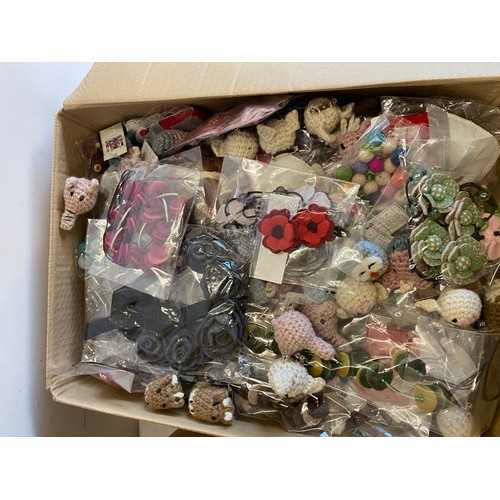 282 - Large selection of assorted new felt hair clips, knitted brooch / badges etc (3 boxes in total)