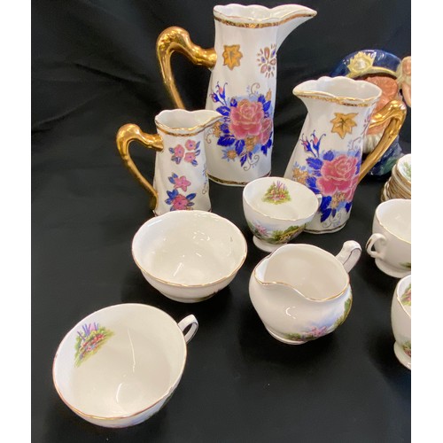 77 - Selection of assorted pottery includes Toby Jug, Graduated jugs, part tea service etc