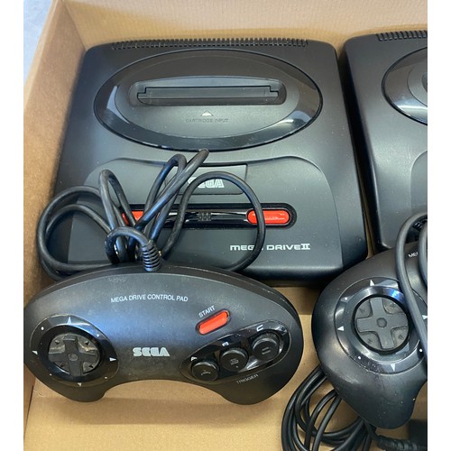 145 - 2 Sega mega drives includes controllers, leads and a laser blast gun for playstation 2