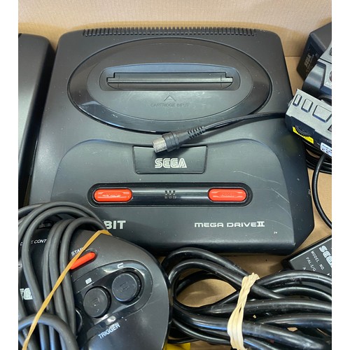 145 - 2 Sega mega drives includes controllers, leads and a laser blast gun for playstation 2