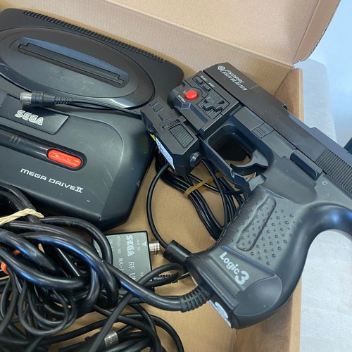 145 - 2 Sega mega drives includes controllers, leads and a laser blast gun for playstation 2