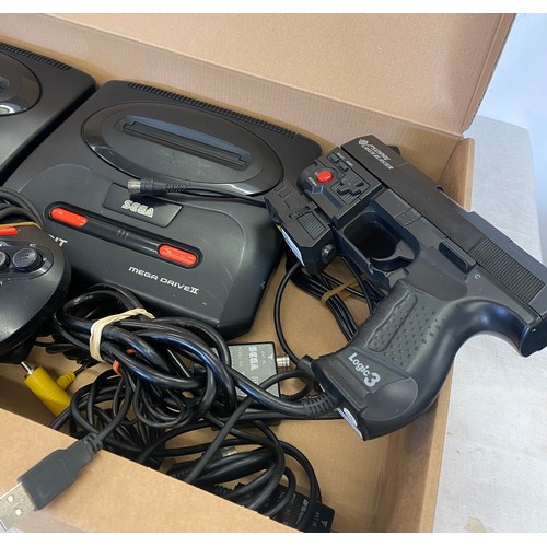 145 - 2 Sega mega drives includes controllers, leads and a laser blast gun for playstation 2