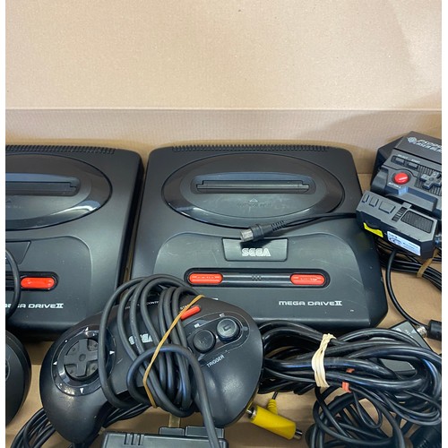 145 - 2 Sega mega drives includes controllers, leads and a laser blast gun for playstation 2