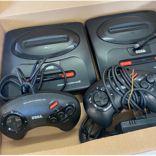 145 - 2 Sega mega drives includes controllers, leads and a laser blast gun for playstation 2