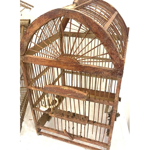 395 - 2 Vintage wooden bird cages, approximate measurements of largest, Height 24 inches, Width 13 inches,... 