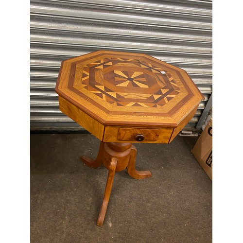 606 - Octagonal inlaid table with three drawer, measures approx 29 inches tall 21.5 inches wide