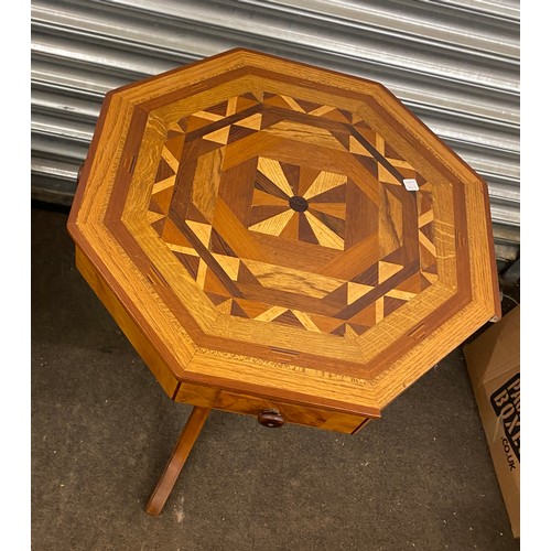 606 - Octagonal inlaid table with three drawer, measures approx 29 inches tall 21.5 inches wide