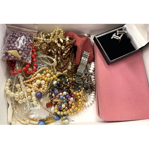 409 - Large selection of assorted costume jewellery to include boxed swarovski pieces, beads, brooches etc