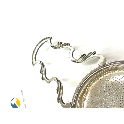 542 - Antique hallmarked sterling silver lemon strainer, London 1763, marker Edward Aldridge II