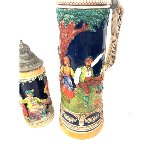 65 - Four vintage german steins largest measures approx 16 inches tall