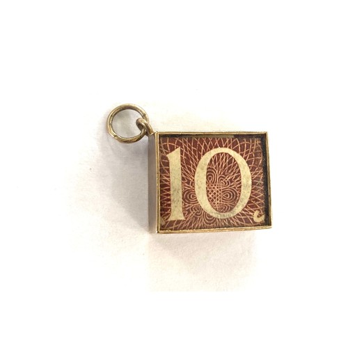 557 - Vintage 9ct ten shilling note charm, approximate weight 2.4g