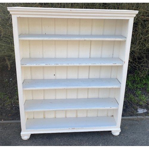 569 - 4 shelf painted bookcase measures approx 55 inches tall 44 inches wide 11 inches depth