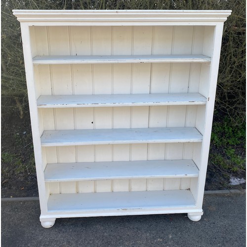 569 - 4 shelf painted bookcase measures approx 55 inches tall 44 inches wide 11 inches depth