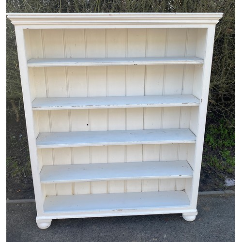 569 - 4 shelf painted bookcase measures approx 55 inches tall 44 inches wide 11 inches depth