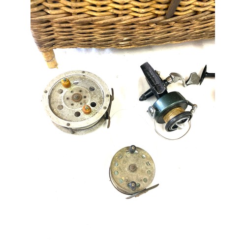 283 - Selection of fishing reels includes Shakespeare ball bearing 2210, New De lux all in a wicker fishin... 