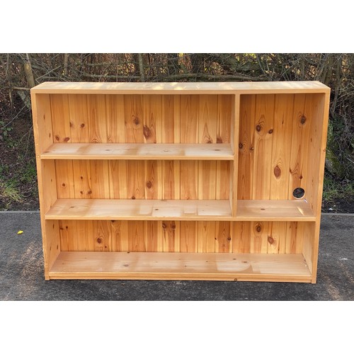 635 - Pine bookcase measures approx 36.5 inches tall 51 inches wide 10.5 inches