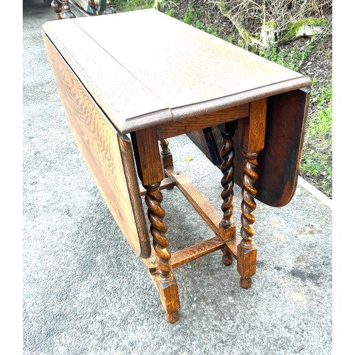 612 - Oak barley twist gate leg table measures approx 36 inches wide 17 inches depth 30 inches tall