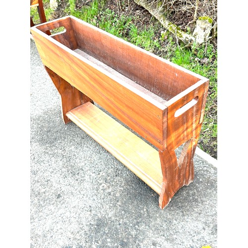 611 - Teak retro plant stand measures approx 22 inches tall 33 inches wide 8.5 inches deep