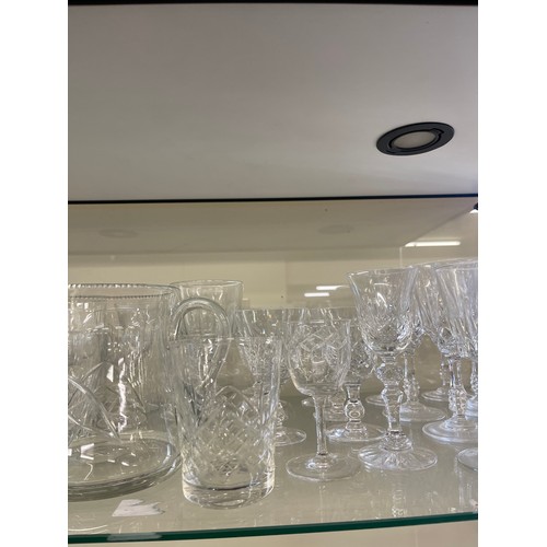 380 - Large selection of vintage and late cut glass includes jug, brandy glasses etc