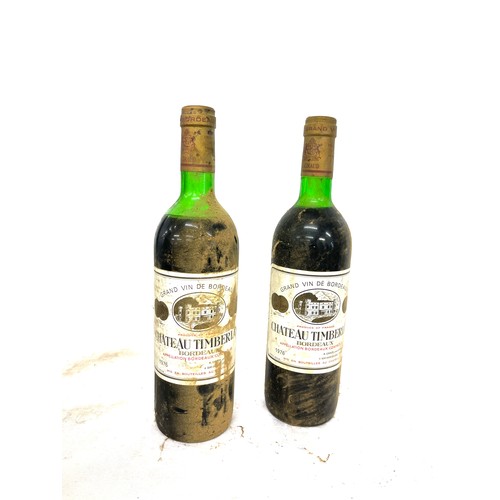 134 - Two bottles of vintage 1976 Grand Vin De Bordeaux Chateau Timberlay wine, 75cl, R'Giraud