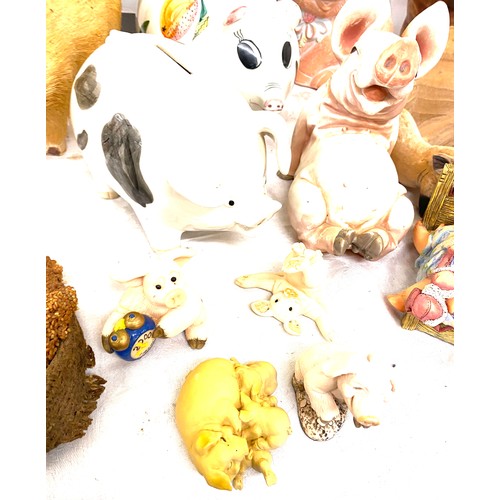 179 - Large selection of assorted pig ornaments includes metal, pottery, straw etc