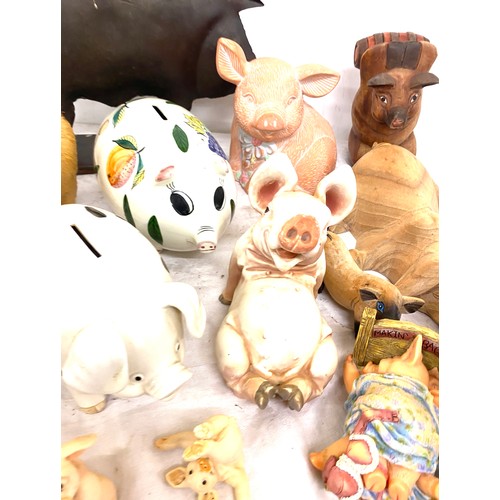 179 - Large selection of assorted pig ornaments includes metal, pottery, straw etc