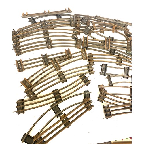 322 - Selection of vintage tin railway pieces to include engine, carriages and track