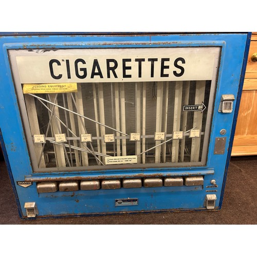 336 - Vintage metal cigarette machine measures approximately Height 32 inches Width 36.5 inches