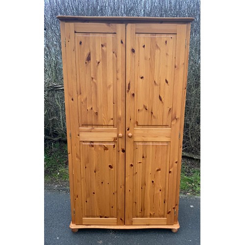 597 - 2 Door pine wardrobe, approximate measurements: Height 71 inches, 41 width, 22 inches depth