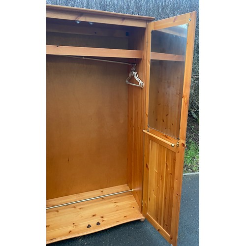 597 - 2 Door pine wardrobe, approximate measurements: Height 71 inches, 41 width, 22 inches depth