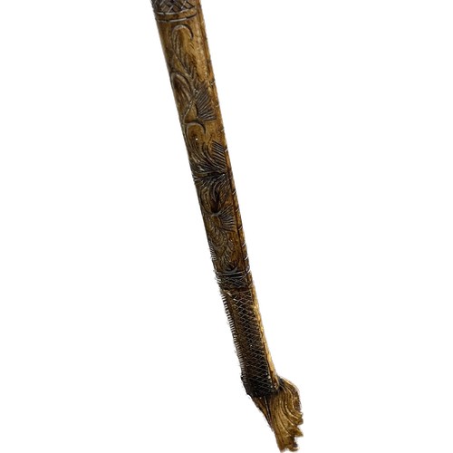 260 - Chinese dragon bone stick measures approx 49 inches long