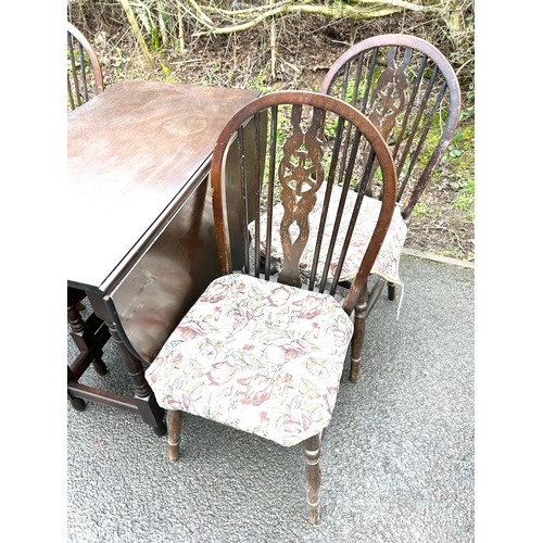 581 - Oak drop leaf table, 4 wheelback chairs