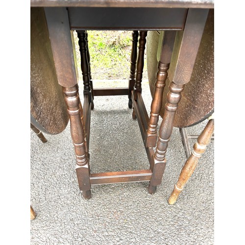 581 - Oak drop leaf table, 4 wheelback chairs