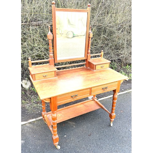 628 - 4 Drawer mahogany dressing table, brass feet, porcelain castors, approximate measurements: Overall H... 