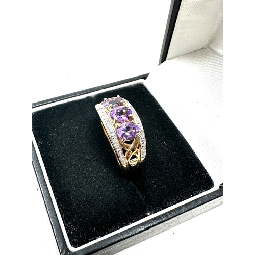 82 - 9ct gold diamond & amethyst ring weight 3.6g