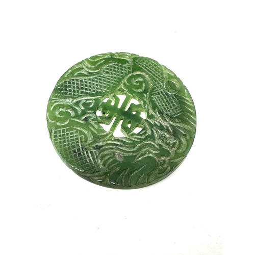 90 - Large Chinese jade roundel measures approx 4.7cm dia