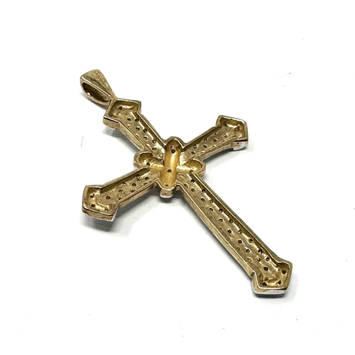 91 - Large 9ct gold diamond cross / pendant measures approx 4.2cm drop by 2.7cm weight 3g