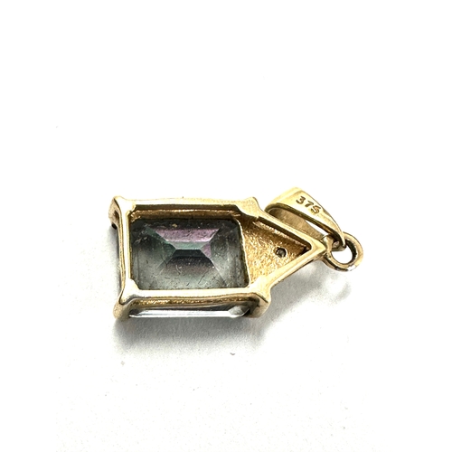 113 - 9ct gold mystic topaz & diamond pendant weight 1.4g