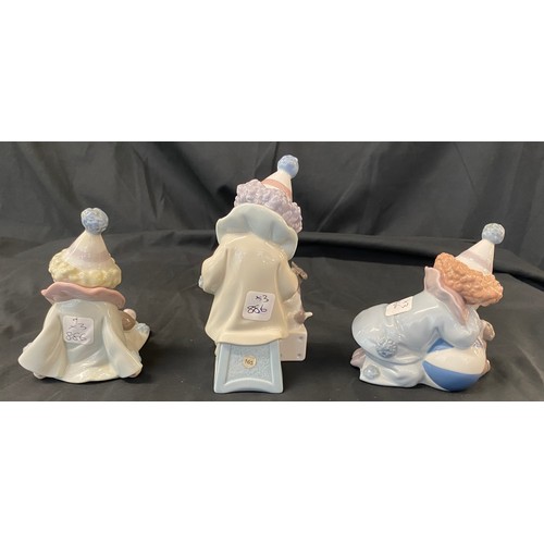 31 - Selection of 3 Lladro figures includes Lladro clown figure seated with puppy dog 5277, clown with co... 