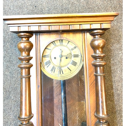 28 - Mahogany Vienna vintage two key hole wall hanging clock with key and pendulum measures approx 33 inc... 