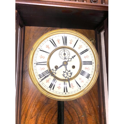 52 - Two key hole Vienna wall clock with pendulum and key- missing top part - measures approx 37 inches t... 