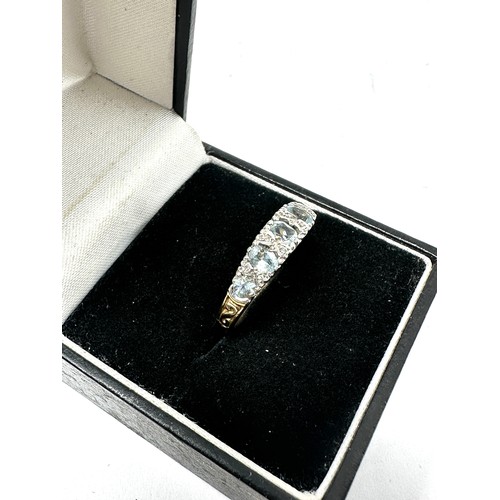 162 - 9ct gold aquamarine five stone ring with diamond accents (2.3g)