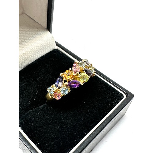 129 - 9ct gold multi-gemstone dress ring inc. topaz, peridot, amethyst, iolite & pink tourmaline (3.3g)