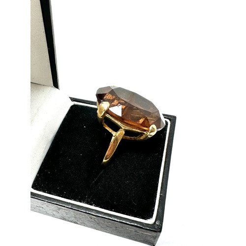 239 - 9ct gold oval cut brown gemstone cocktail ring (10.4g)