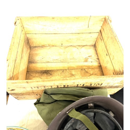 302 - Vintage tins, military helmets in a vintage tomato crate